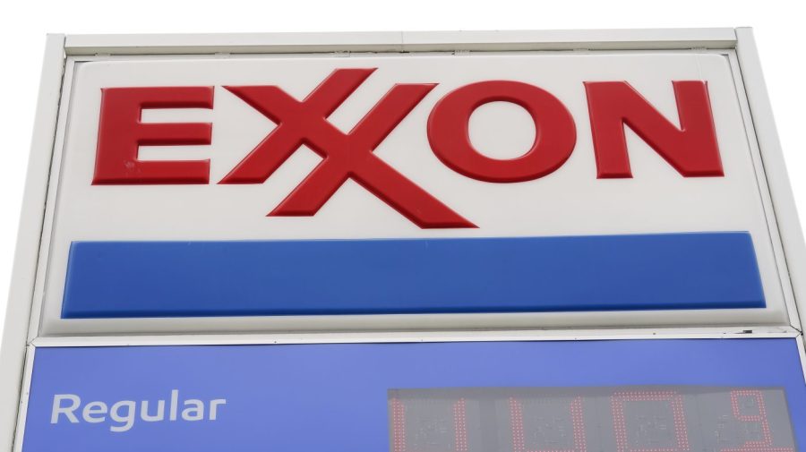 FILE - An Exxon gas station is shown in Upper Darby, Pa., on April 26, 2022. Exxon Mobil Corp. is buying Pioneer Natural Resources in an all-stock deal valued at $59.5 billion, its largest buyout since acquiring Mobil two decades ago, creating a colossal fracking operator in West Texas. (AP Photo/Matt Rourke, File)