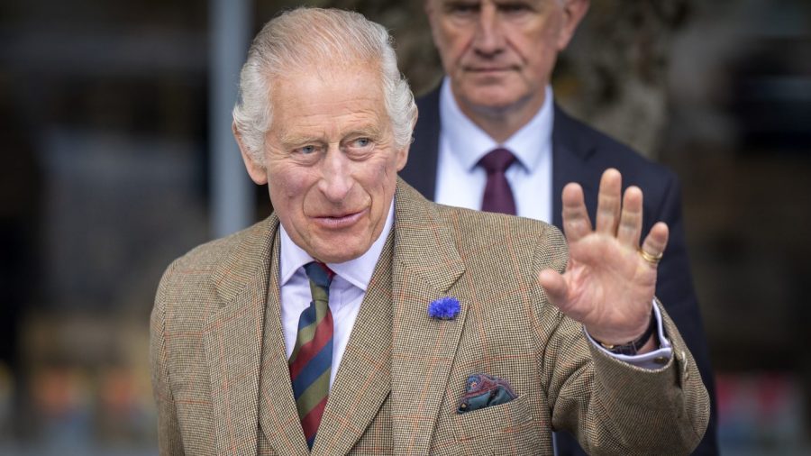 FILE - Britain's King Charles III waves during his visit to the Discovery Centre and Auld School Close to hear more about the 3.3 million pound (4.1 million US dollars) energy efficient housing project in the area, in Tomintoul, Scotland, Wednesday, Sept. 13, 2023.