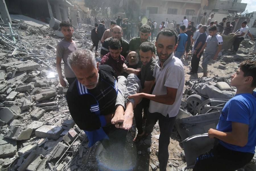 Palestinians evacuate wounded in the Israeli bombardment of Rafah, southern Gaza Strip, Tuesday, Oct. 17, 2023. (AP Photo/Hatem Ali)