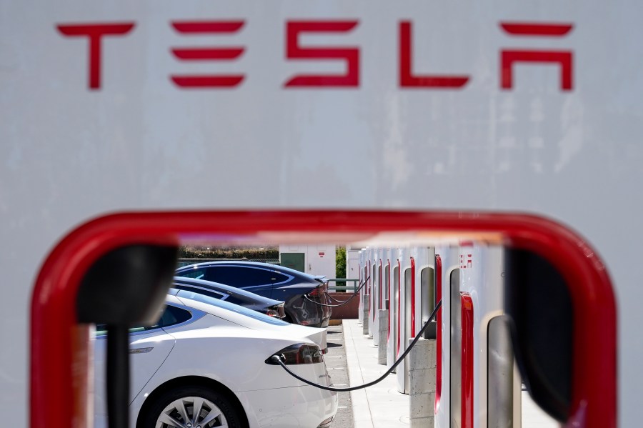 File - Tesla vehicles charge at a station in Emeryville, Calif., Wednesday, Aug. 10, 2022. Tesla reports earnings on Wednesday, Oct. 18, 2023 (AP Photo/Godofredo A. Vásquez, File)