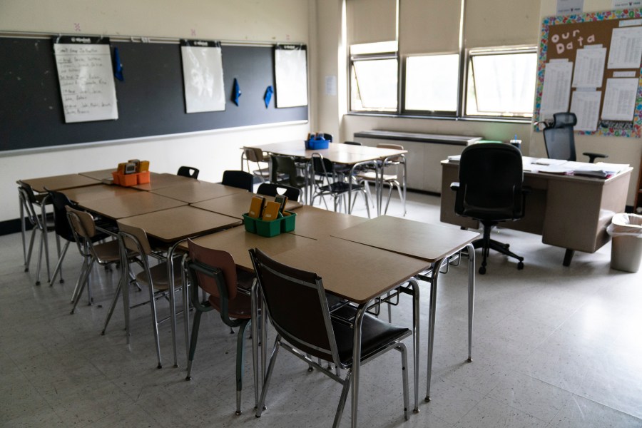 FILE - Desks fill a classroom in a high school Wednesday, May 3, 2023.