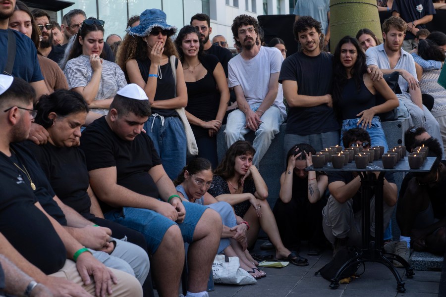 Mourners attend a funeral of the Israeli man Ziv Shapira who was killed by Hamas militants, outside a bar in Tel Aviv, Israel , on Thursday, Oct. 19, 2023. (AP Photo/Petros Giannakouris)