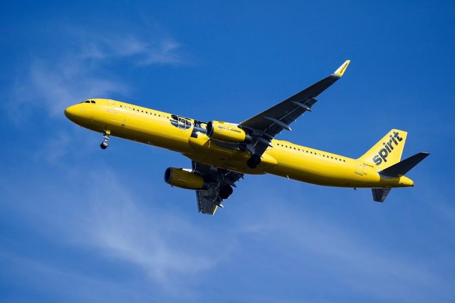 FILE - A Spirit Airlines jet approaches Philadelphia International Airport in Philadelphia, Feb. 24, 2021. Spirit Airlines canceled about 100 flights on Friday, Oct. 20, 2023, after pulling some planes out of service for inspections, and the airline expects the disruptions to last several days. (AP Photo/Matt Rourke, File)