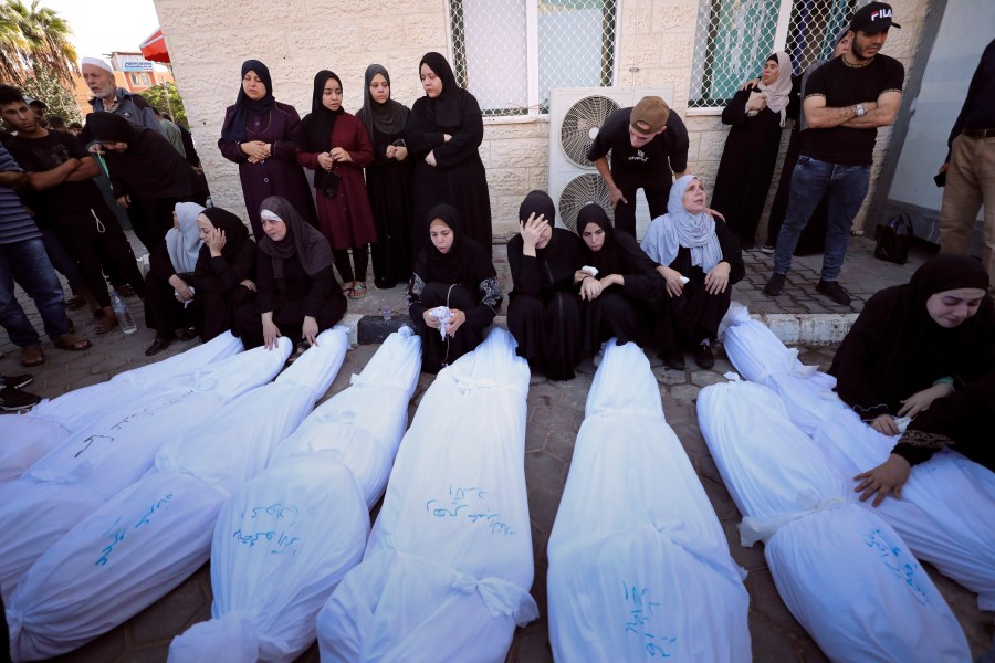 Palestinians mourn their relatives killed in the Israeli bombardment on the Gaza Strip, at Al Aqsa hospital in Deir el-Balah, Friday, Oct. 20, 2023. (AP Photo/Ali Mahmoud)