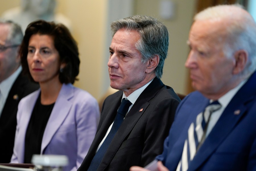 From left, Commerce Secretary Gina Raimondo, Secretary of State Antony Blinken and President Joe Biden listen during a meeting with European Council President Charles Michel and European Commission President Ursula von der Leyen in the Cabinet Room of the White House, Friday, Oct. 20, 2023, in Washington. (AP Photo/Evan Vucci)