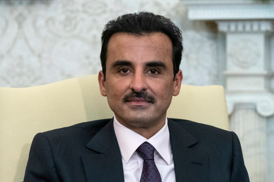 FILE - Qatar's Emir Sheikh Tamim bin Hamad Al Thani reacts while speaking in the White House, Monday, Jan. 31, 2022, in Washington. Sheikh Tamim bin Hamad Al Thani, channeled the wider anger in the Arab world over Israel's unrelenting airstrikes and siege of the Gaza Strip that the Hamas-controlled Health Ministry says has killed over 5,000 people so far. (AP Photo/Alex Brandon, File)