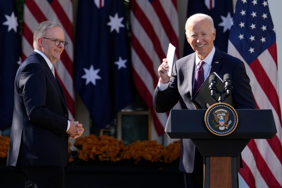 President Joe Biden and Australia's Prime Minister Anthony Albanese wrap up after speaking in the Rose Garden of the White House during a news conference in Washington, Wednesday, Oct. 25, 2023. (AP Photo/Manuel Balce Ceneta)