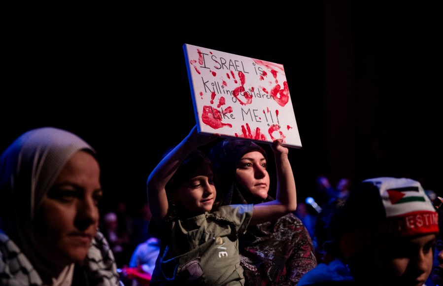 A woman and child attend a rally in support of Palestine in Dearborn, Detroit on Oct. 10, 2023. Many top Michigan Democrats, including Gov. Gretchen Whitmer, took part in a huge pro-Israel rally near Detroit after the Hamas Oct. 7 attack on the country. None of them attended a rally in nearby Dearborn the next day to show support for Palestinians in Gaza being killed or forced from their homes by the Israeli military’s response. The war has inflamed tensions between Jews and Muslims everywhere, including the Detroit area, which is home to several heavily Jewish suburbs and Dearborn, the city with the largest concentration of Arab Americans in the U.S. (Matthew Hatcher/Detroit News via AP)