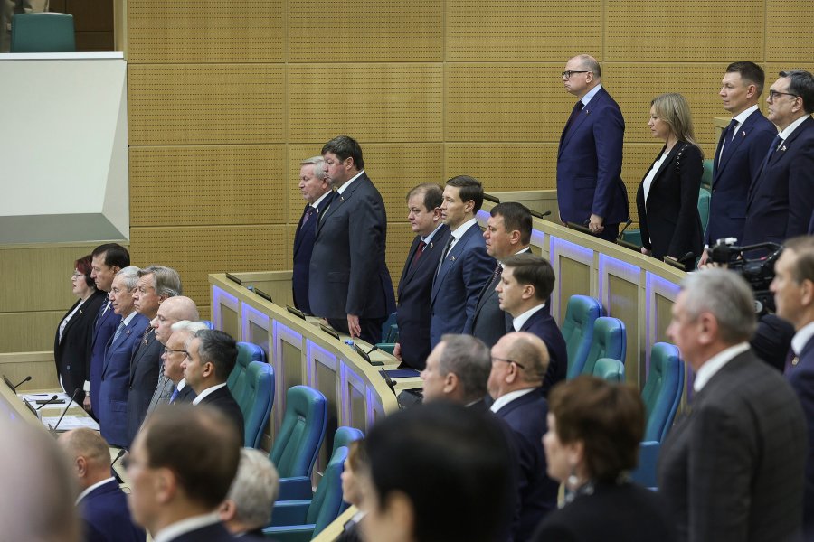 In this photo provided by The Federation Council of The Federal Assembly of The Russian Federation Press Service, lawmakers of Federation Council of the Federal Assembly of the Russian Federation listen to the national anthem prior to a session in Moscow, Russia, Wednesday, Oct. 25, 2023. The upper house of the Russian parliament has revoked the ratification of a global nuclear test ban in what Moscow has described as a move to put itself on par with the United States. (Federation Council of the Federal Assembly of the Russian Federation via AP)