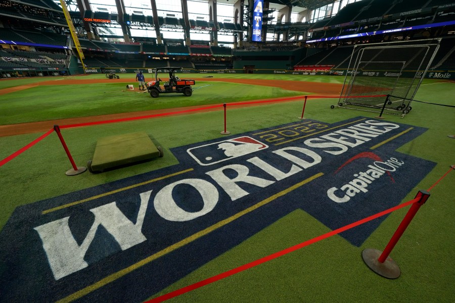 Signage is seen near the infield at Globe Life Field ahead of the World Series between the Texas Rangers and the Arizona Diamondbacks, Wednesday, Oct. 25, 2023, in Arlington, Texas. (AP Photo/Julio Cortez)