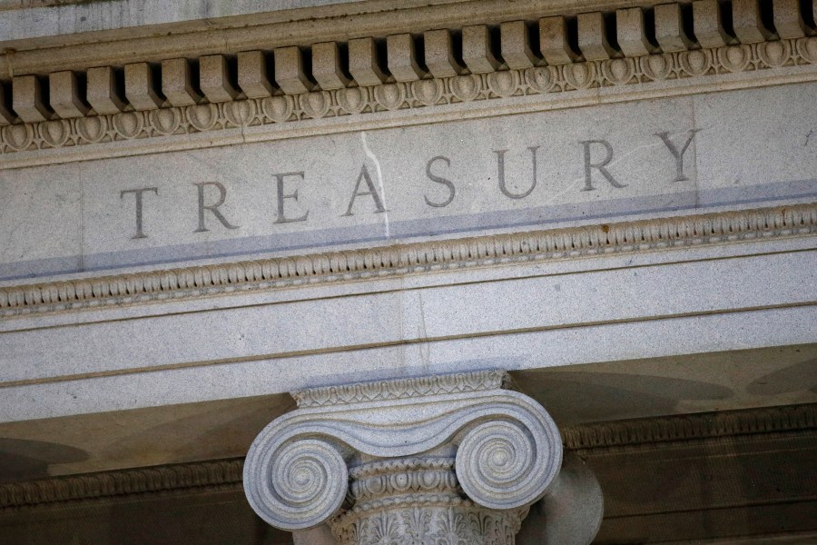 FILE- The U.S. Treasury Department building is shown at dusk in Washington on June 6, 2019. The United States on Friday, Oct. 27, 2023 expanded its effort to cut off funding for Hamas, announcing a second round of sanctions against people and organizations linked to the group since it launched an attack on Israel that killed more than 1,400 people. (AP Photo/Patrick Semansky, File)