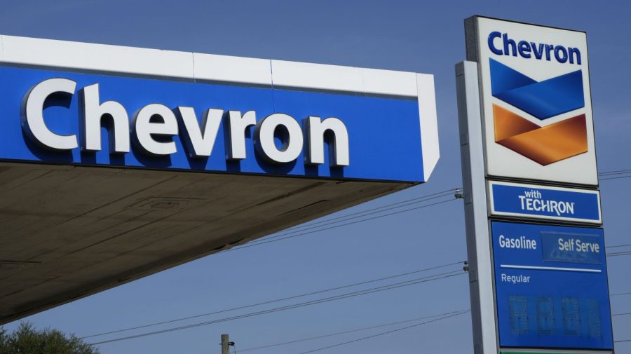 File - Chevron logos are displayed at a gas station in Columbus, Miss., Monday, Oct. 23, 2023. The San Ramon, California, company posted a third-quarter profit of $6.53 billion, or $3.48 per share. Earnings, adjusted for pretax gains, came to $3.05 per share. (AP Photo/Rogelio V. Solis, File)