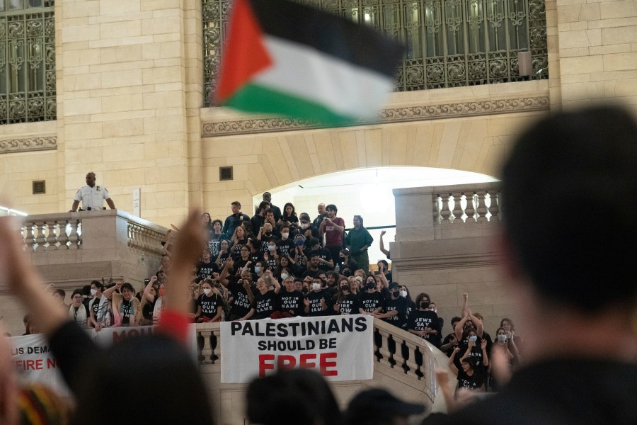 Protesters gather at Grand Central Terminal during a rally calling for a ceasefire between Israel and Hamas on Friday, Oct. 27, 2023, in New York. (AP Photo/Jeenah Moon)