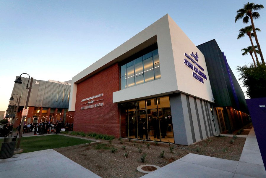 FILE - The Jerry Colangelo Museum at Grand Canyon University is seen at at dusk in Phoenix, on Sept. 20, 2017. Grand Canyon University, the country's largest Christian university, is being fined $37.7 million by the federal government amid accusations that it misled students about the cost of its graduate programs. (AP Photo/Matt York, File)