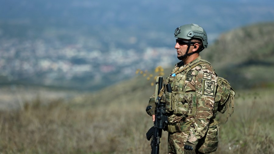 An Azerbaijani serviceman on patrol on Tuesday, Oct. 3, 2023, near Khankendi, Azerbaijan, also known as Stepanakert to Armenians. (AP Photo/Aziz Karimov)