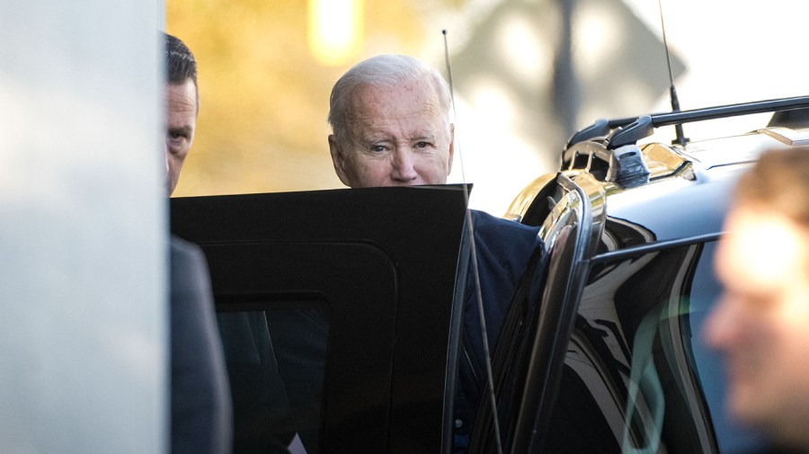 Joe Biden gets into a vehicle