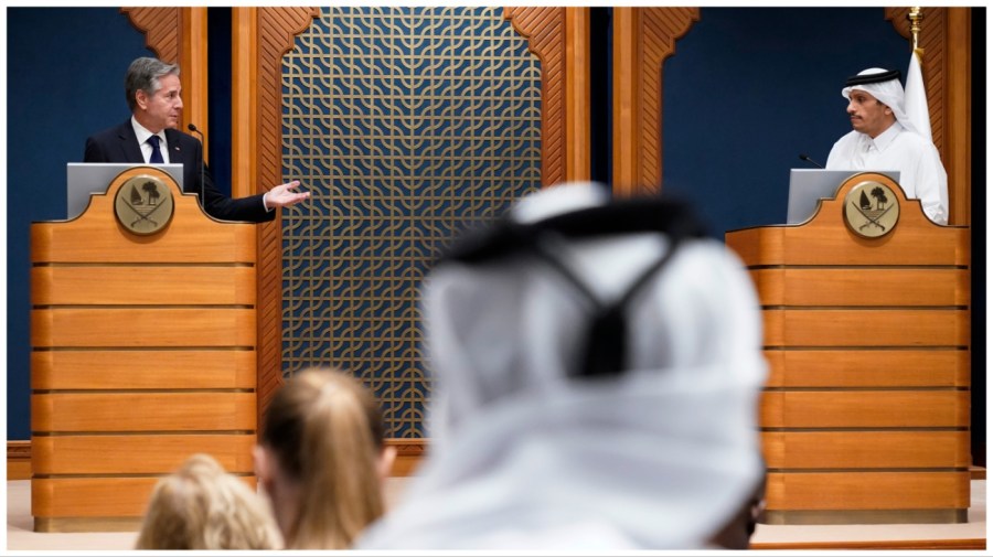 Qatar's Prime Minister and Foreign Minister Mohammed bin Abdulrahman Al Thani, right, and U.S. Secretary of State Antony Blinken make statements in Doha, Qatar, Friday Oct. 13, 2023. (AP Photo/Jacquelyn Martin, Pool)