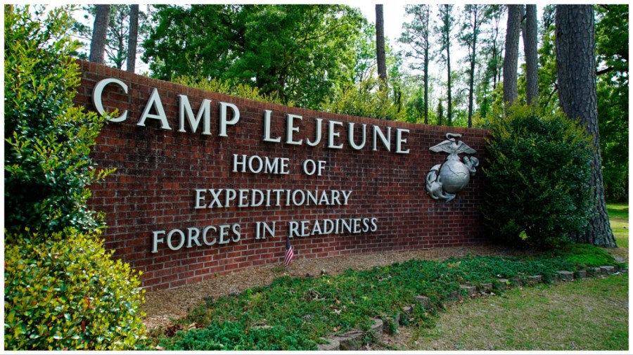 FILE - Signage stands on the main gate to Camp Lejeune Marine Base outside Jacksonville, N.C., Friday, April 29, 2022. (AP Photo/Allen G. Breed, File)