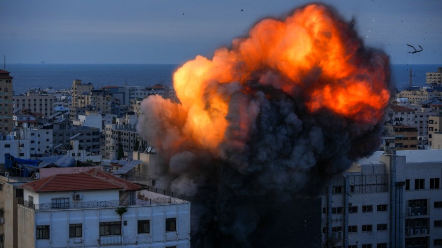 Fire and smoke rise following an Israeli airstrike, in Gaza City, Sunday, Oct. 8, 2023.