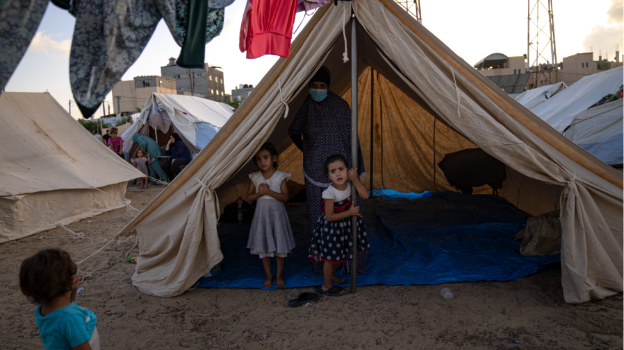 Palestinian children displaced by the Israeli bombardment of the Gaza Strip stay in a UNDP-provided tent camp in Khan Younis on Thursday, Oct. 19, 2023. Many Palestinians in Gaza who heeded the Israeli military's warnings last week advising them to head south thought they were fleeing to a safer place. But they watched as dozens of people like them met the same grim fate they were running from: killed by Israeli airstrikes raining down on residential towers and United Nations shelters, outside the evacuation zone.