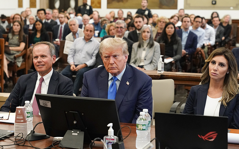 Former President Trump, center, sits in the courtroom at New York Supreme Court flanked by his attorneys.