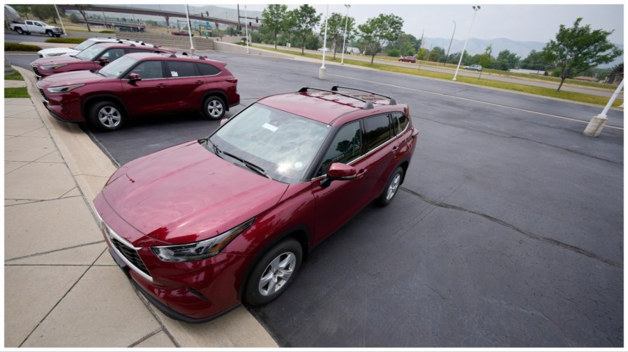 In this Sunday, Aug. 1, 2021, photograph, a small collection of unsold 2021 Highlander sports-utility vehicles sits in an otherwise empty storage lot outside a Toyota dealership in Lakewood, Colo. (AP Photo/David Zalubowski)