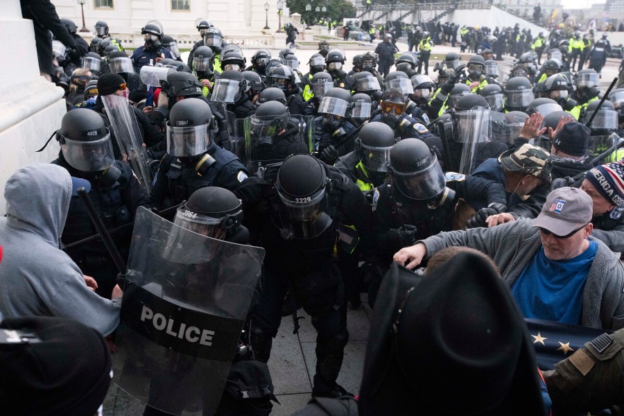 FILE - In this Jan. 6, 2021, file photo, U.S. Capitol Police push back rioters trying to enter the U.S. Capitol in Washington.