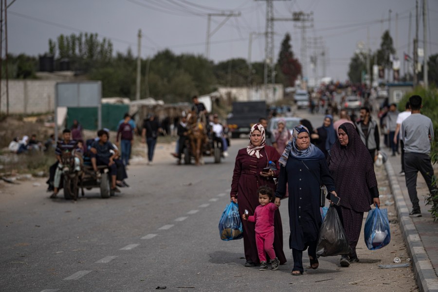 Palestinians flee to the southern Gaza Strip on Salah al-Din Street in Bureij, Gaza Strip, Saturday, Nov. 11, 2023. (AP Photo/Fatima Shbair)