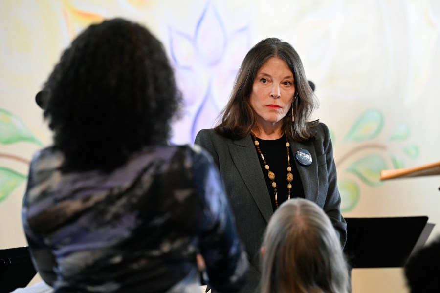 Democratic presidential candidate Marianne Williamson, right, answers a question from the audience at The Interfaith Center for Spiritual Growth, Sunday, Sept. 10, 2023, in Ann Arbor, Mich. (AP Photo/Jose Juarez)