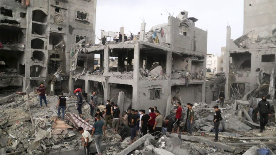 Palestinians look for survivors after an Israeli strike on a building last night in Jebaliya refugee camp, Gaza Strip, Tuesday, Nov. 14, 2023. (AP Photo/Mahmoud Abo Salamah)