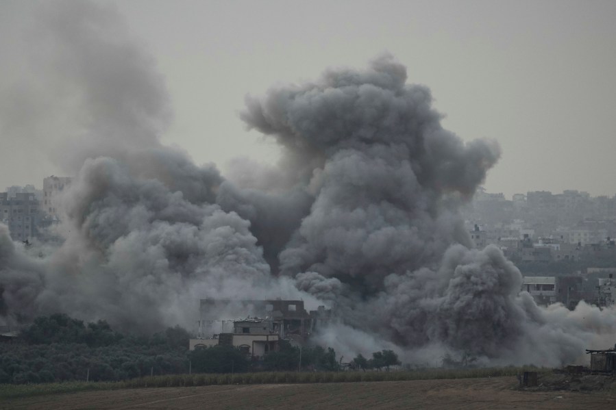 FILE - Smoke rises following an Israeli airstrike in the Gaza Strip, as seen from southern Israel on Nov. 12, 2023. As the military sets its sights on southern Gaza in its campaign to stamp out Hamas, key challenges loom. International patience for a protracted invasion has begun to wear thin. And with some 2 million displaced Gaza residents staying in crowded shelters in the south in dire conditions, a broad military offensive there could unleash a new humanitarian disaster during the cold, wet winter.(AP Photo/Leo Correa, File)