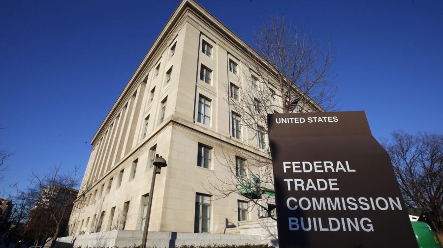 A sign stands outside the Federal Trade Commission building, Jan. 28, 2015, in Washington. On Wednesday, Nov. 15, 2023, the FTC said it issued warnings to two food and beverage industry groups, as well as a dozen online influencers and dietitians for failing to adequately disclose paid social media posts that promoted a sweetener and sugary products. (AP Photo/Alex Brandon, File)