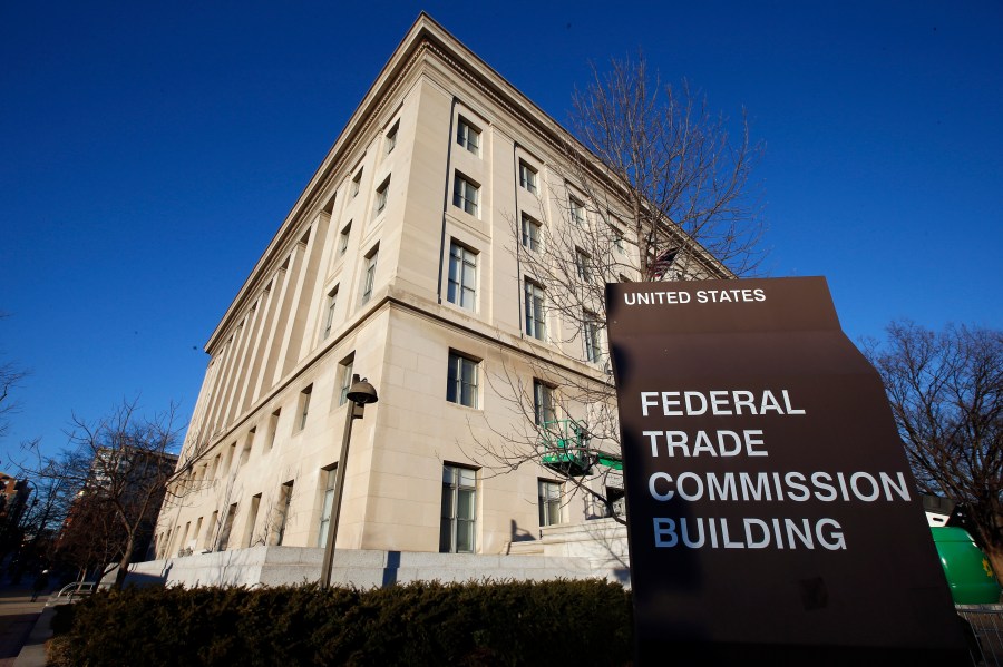 FILE - A sign stands outside the Federal Trade Commission building, Jan. 28, 2015, in Washington. On Wednesday, Nov. 15, 2023, the FTC said it issued warnings to two food and beverage industry groups, as well as a dozen online influencers and dietitians for failing to adequately disclose paid social media posts that promoted a sweetener and sugary products. (AP Photo/Alex Brandon, File)
