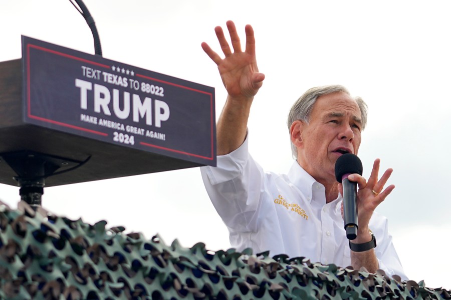 Texas Gov. Greg Abbott endorses Republican presidential candidate and former President Donald Trump during an event at the South Texas International Airport Sunday, Nov. 19, 2023, in Edinburg, Texas. (AP Photo/Eric Gay)