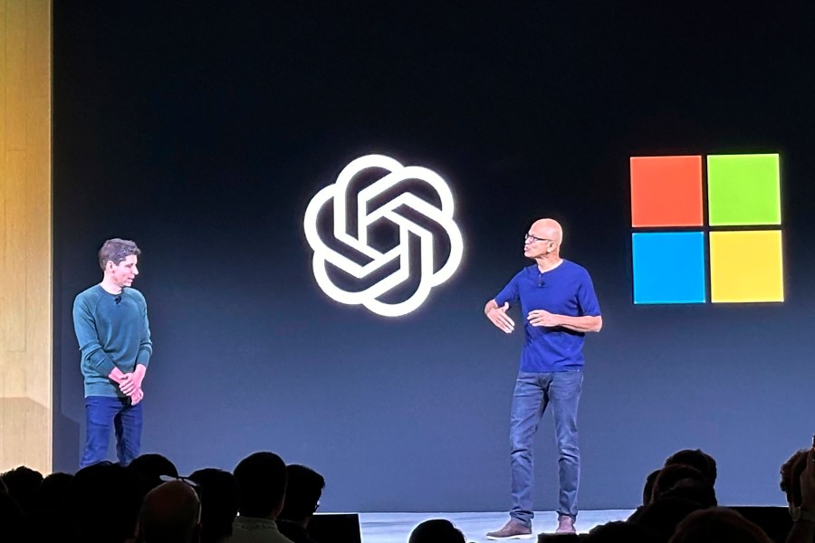 File - Sam Altman, left, appears onstage with Microsoft CEO Satya Nadella at OpenAI's first developer conference, on Nov. 6, 2023, in San Francisco. Microsoft snapped up Altman for a new venture after his sudden departure from OpenAI shocked the artificial intelligence world. (AP Photo/Barbara Ortutay, File)