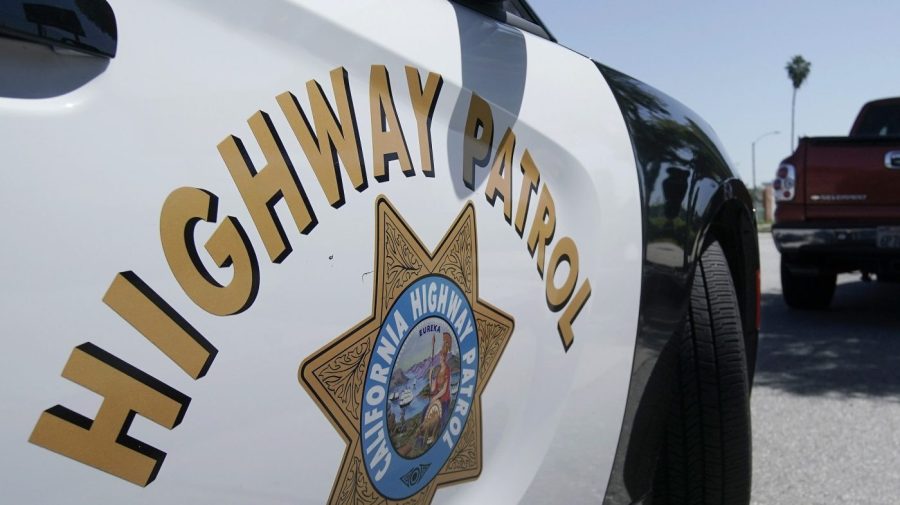 FILE - A California Highway Patrol officer stops a motorist in Anaheim, Calif., April 23, 2020. State authorities were investigating Monday, Nov. 20, 2023, after a California Highway Patrol officer shot and killed a man on a Los Angeles area freeway during a struggle over the weekend that was recorded on video. (AP Photo/Chris Carlson, File)