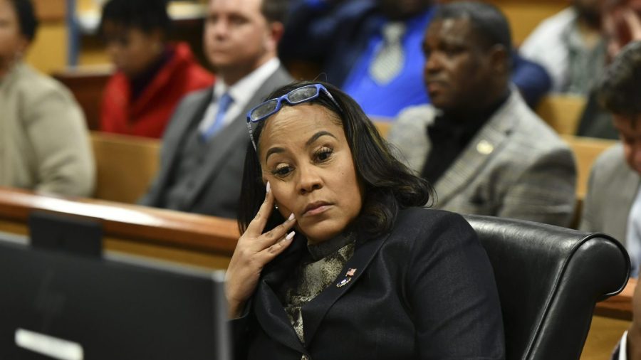 Fulton County District Attorney Fani Willis appears during a hearing regarding defendant Harrison Floyd, a leader in the organization Black Voices for Trump, as part of the Georgia election indictments, Tuesday, Nov. 21, 2023, in Atlanta. Fulton County Superior Court Judge Scott McAfee heard arguments Tuesday on a request to revoke Floyd's bond, of one of former President Donald Trump's co-defendants in the Georgia case related to efforts to overturn the 2020 election. Willis, in a motion filed last week, says that Floyd has been attempting to intimidate and contact likely witnesses and his co-defendants in violation of the terms of his release. (Dennis Byron/Hip Hop Enquirer via AP)