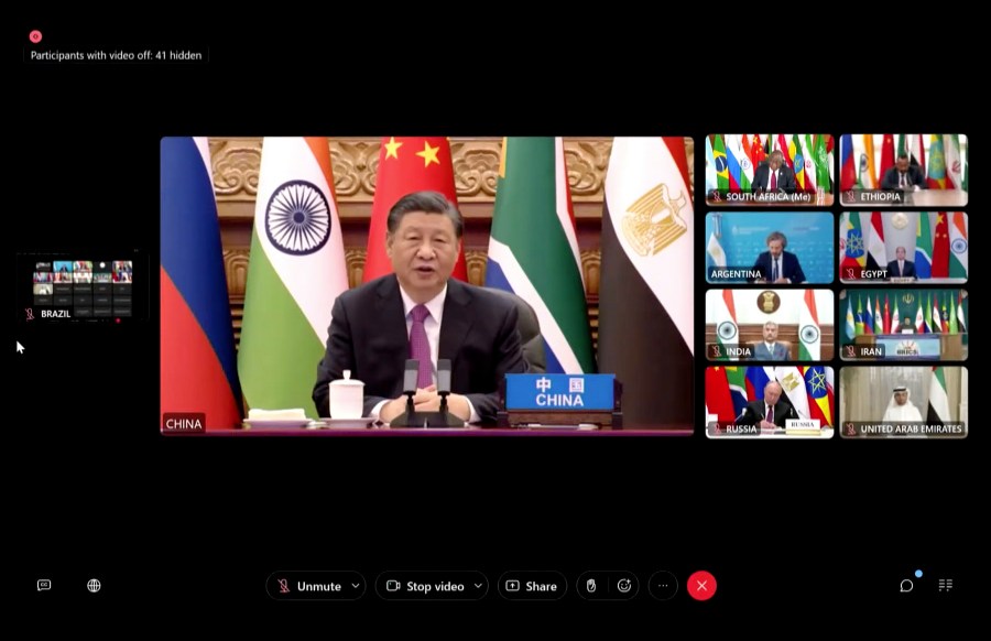 On this video framegrab of a feed distributed by South Africa's Presidency, China's Xi Jinping joins other BRICS leaders for a virtual meeting of leaders of developing countries Tuesday, Nov. 21, 2023, where South African President Cyril Ramaphosa accused Israel of war crimes, condemned Hamas for its attack on Israeli civilians that sparked the conflict and said both sides were guilty of violating international law. (AP Photo)