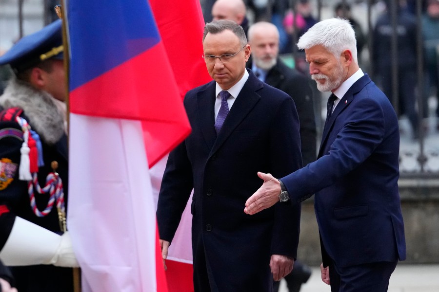 Czech Republic's President Petr Pavel, right, welcomes Poland's President Andrzej Duda, left, for the V4 Summit in Prague, Czech Republic, Wednesday, Nov. 22, 2023. (AP Photo/Petr David Josek)
