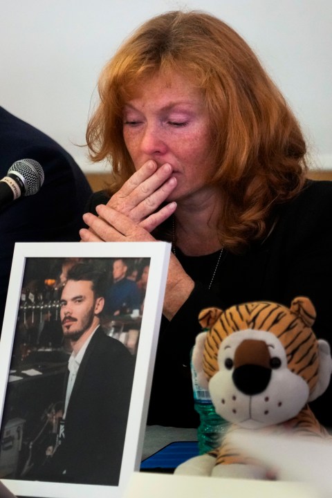 Evgenia Kozlov gets emotional during a press conference at the Italian Jewish Center in Rome, Wednesday, Nov. 22, 2023, with other representatives of the families of the Israelis abducted by Hamas militants on Oct. 7 and believed to be held hostages in Gaza, shortly after they met with Pope Francis at The Vatican. Her 27-year-old son Andrei, depicted in the framed photograph, a Russian citizen, was abducted by Hamas militants from the "Nova" Music Festival near Kibbutz Re'im during the militant group's unprecedented attack on Israel on Oct. 7 that resulted in the killing of 1,400 people and the abduction of over 220. (AP Photo/Gregorio Borgia)