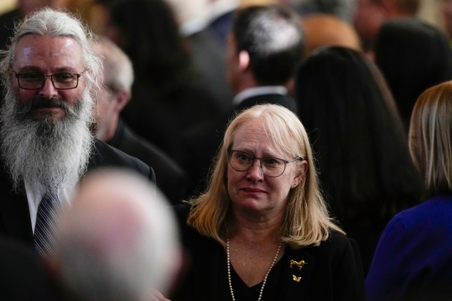 Amy Carter and her husband John Joseph "Jay" Kelly walk after a tribute service for former first lady Rosalynn Carter at Glenn Memorial Church at Emory University on Tuesday, Nov. 28, 2023, in Atlanta. (AP Photo/Brynn Anderson, Pool)