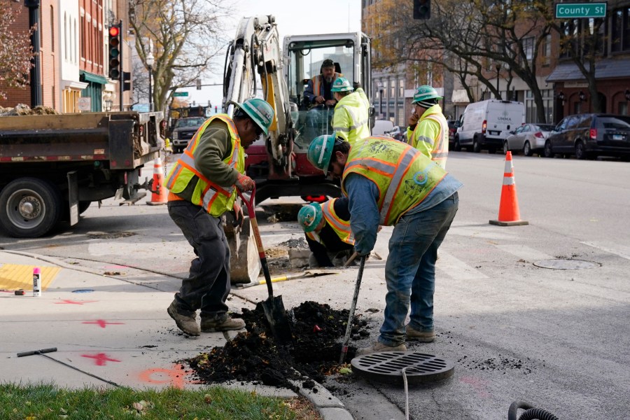 Workmen dig on a street in Waukegan, Ill., Monday, Nov. 6, 2023. On Wednesday, the Commerce Department issues its second of three estimates of how the U.S. economy performed in the third quarter of 2023. (AP Photo/Nam Y. Huh)