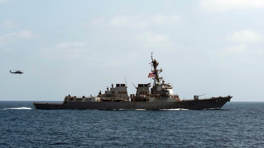 File - In this image released by the U.S. Navy, the USS Mason (DDG 87), conducts maneuvers as part of a exercise in the Gulf of Oman on Sept. 10, 2016.