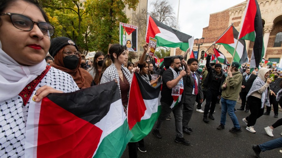 Pro-Palestinian demonstrators march down J Street during a protest in conjunction with the 2023 California Democratic Party Convention, Saturday, Nov. 18, 2023, in Sacramento, Calif.