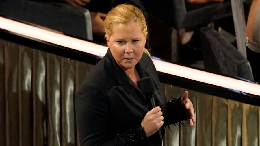 Host Amy Schumer speaks in the audience at the Oscars on Sunday, March 27, 2022, at the Dolby Theatre in Los Angeles.