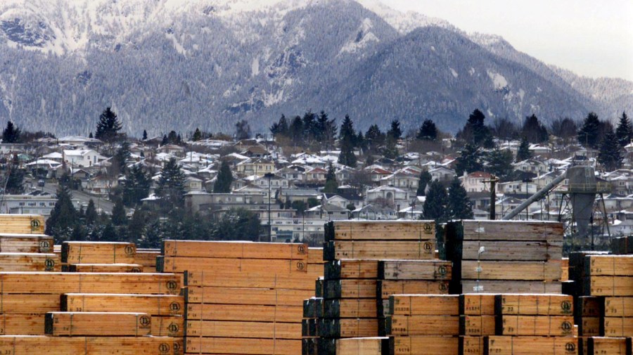 Piles of softwood lumber destined for export, are stacked at a Richmond, B.C., Canada lumberyard, March 20, 2002.