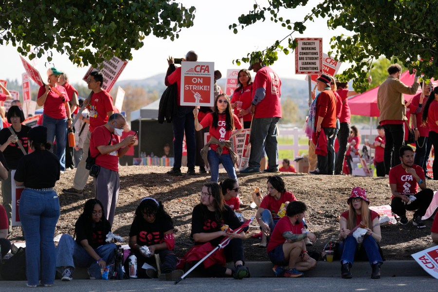 Members of the California Faculty Association rally and picket during a strike at California State Polytechnic University, Pomona on Monday, Dec. 4, 2023, in Pomona, Calif.