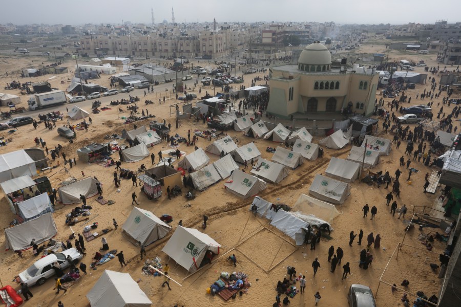 Palestinians fleeing the Israeli ground offensive arrive in Rafah, Gaza Strip, Tuesday, Dec. 5, 2023. (AP Photo/Hatem Ali)