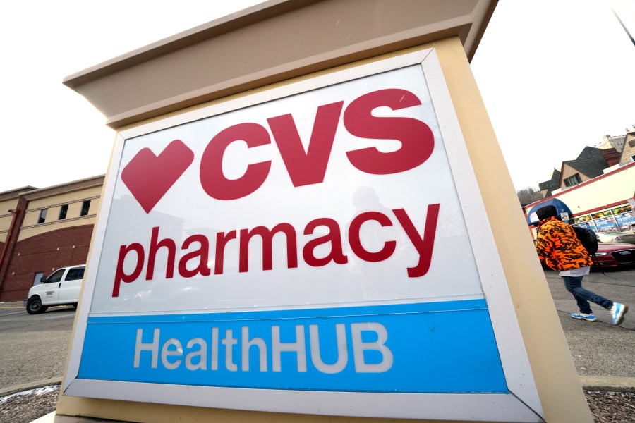 FILE - A CVS store sign is displayed in Pittsburgh on Feb. 3, 2023. CVS Health is introducing changes to how its prescription drug pricing model works, and that could lead to some savings for customers starting next year. The health care giant said Tuesday, Dec. 5, 2023 that it will role out a new reimbursement model designed to make costs more predictable at the drugstore counter. (AP Photo/Gene J. Puskar, File)