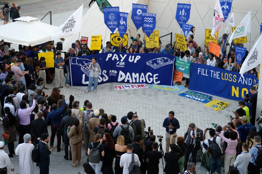 Activists demonstrate for the loss and damage fund at the COP28 U.N. Climate Summit, Wednesday, Dec. 6, 2023, in Dubai, United Arab Emirates. (AP Photo/Peter Dejong)